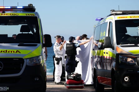 Police and emergency personnel at Sydney’s Coogee beach after reports of a shark attack
