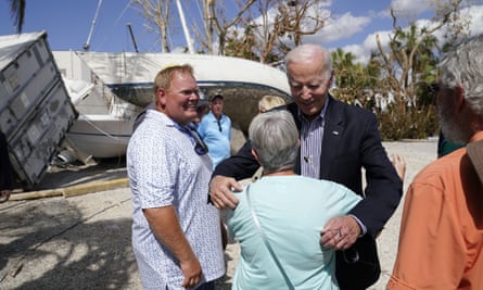 Joe Biden hugs a local resident in Fort Myers Beach.