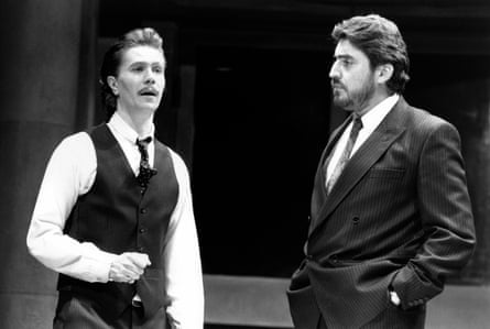 Gary Oldman and Alfred Molina on stage in Serious Money, facing each other talking
