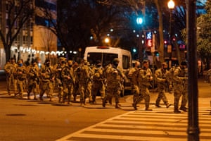National Guard troops march towards an entry point into the inauguration’s Red Zone