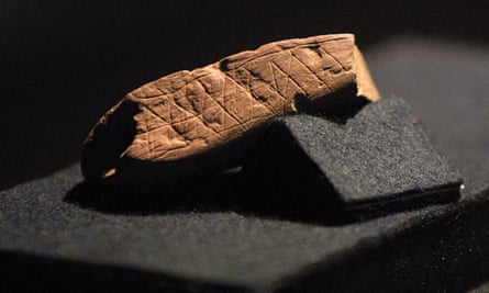 Even older still … a piece of red ochre with a deliberate zigzag engraving from Blombos cave, South Africa.