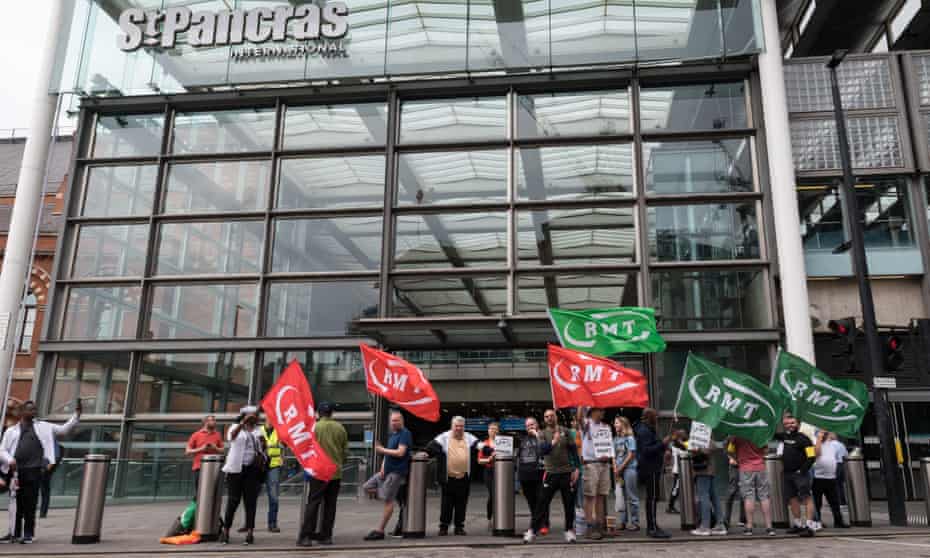 RMT union members join the picket line outside St Pancras International station in London.