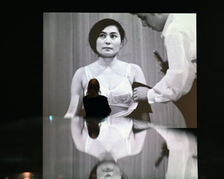 A woman stands in front of Yoko Ono’s ‘Cut Piece’, 1965