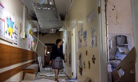 Svitlana Dmtrieva, head of peadiatrics at a primary care centre and family clinic in Mykolaiv inspects her office and department destroyed by a military strike