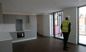 Architect Ivan Harbour inside the two-bedroom, pop-up apartment.