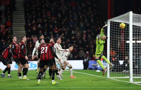 Bournemouth keeper Djordje Petrovic is beaten by a glancing header from Liverpool’s Virgil van Dijk (hidden) to get the visitors back into the game.