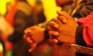 People taking part in Christmas Eve prayers in Srinagar, India.