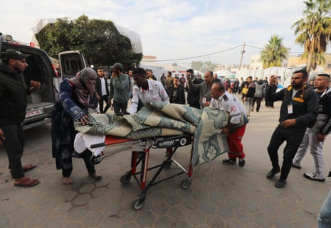 Palestinians injured in Israeli airstrikes arrive at al-Aqsa hospital in Deir al-Balah, Gaza.