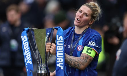 Chelsea's Millie Bright holds the League Cup trophy after the 2-1 win over Manchester City.