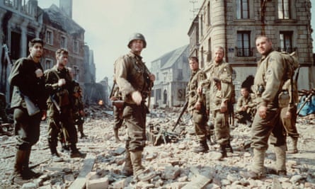 Tom Sizemore, right, with Tom Hanks, centre, in Saving Private Ryan, 1998.