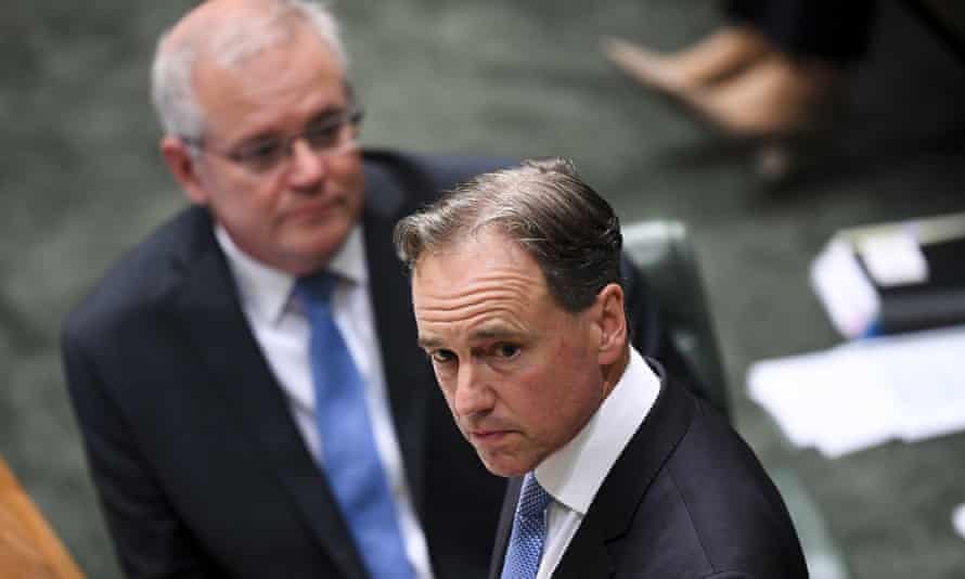 Australian health minister Greg Hunt speaks in parliament as prime minister Scott Morrison watches on