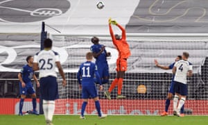 Chelsea keeper Edouard Mendy attempts to claim the ball.