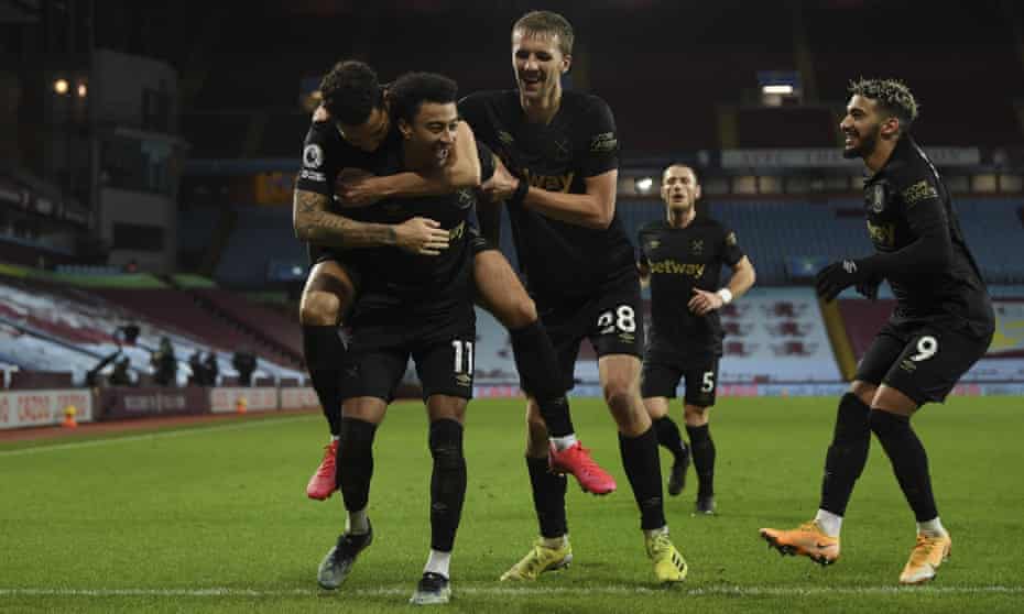 Jesse Lingard is mobbed by his new West Ham teammates.