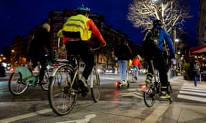 Parisians ride bikes and scooters in Paris