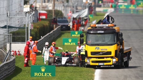 The car of Yuki Tsunoda is recovered from the track after stopping on the formation lap.
