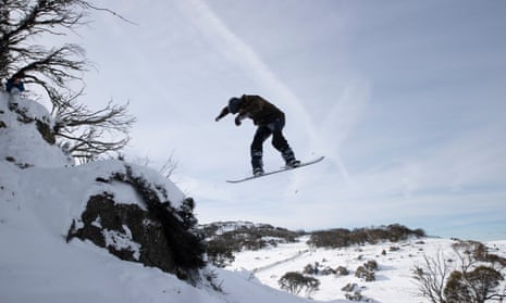 Rick from Melbourne comes off a rock outcrop at Perisher which has opened early this weekend
