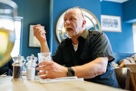 Tony chatting at a restaurant table