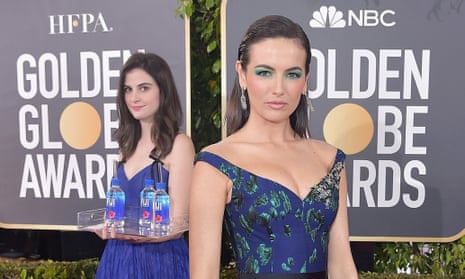 Camilla Belle and the ‘Fiji Water Girl’ attend the 76th Annual Golden Globe Awards in Los Angeles on Sunday night.