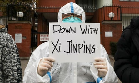 A person holds a banner outside the Chinese consulate in Toronto, Canada, during a protest in solidarity over Covid restrictions in China.