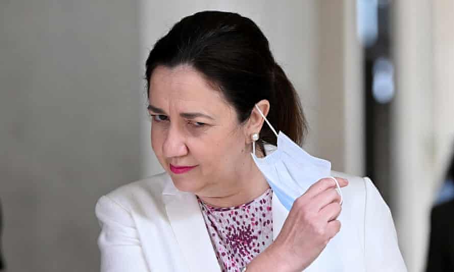Queensland Premier Annastacia Palaszczuk takes off her mask to speak at Parliament House on in Brisbane on Tuesday morning.