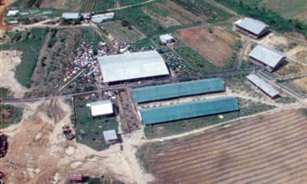 The Peoples Temple compound is seen in aerial view as helicopters approach Jonestown