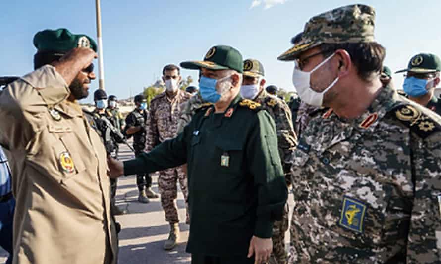Hossein Salami (centre), with Rear Admiral Alireza Tangsiri, inspects troops during his visit to the island of Abu Musa