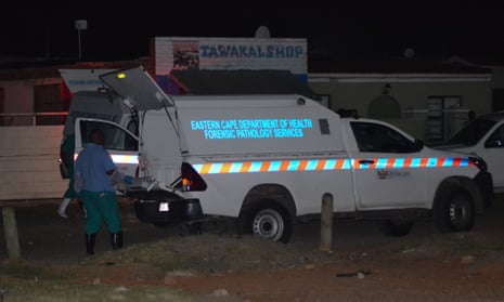 Members of a forensic team at the scene of a mass shooting in Gqeberha, South Africa