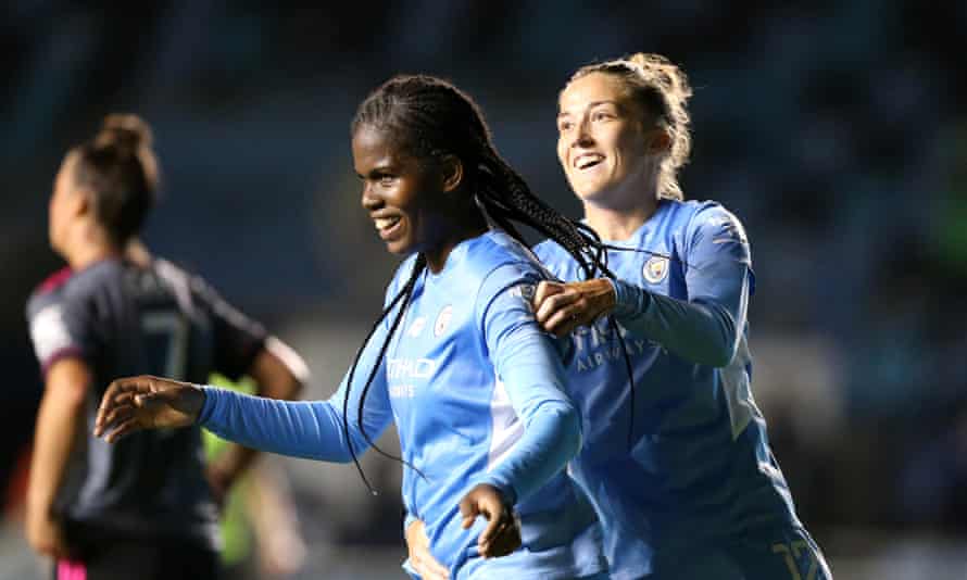 Khadija Shaw celebrates with Filippa Angeldal after completing a hat-trick for Manchester City.