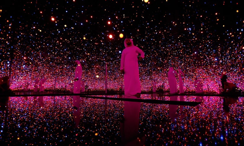 Visitors to a pre-opening exhibition at the Guggenheim Abu Dhabi walk through an installation by Yayoi Kusama