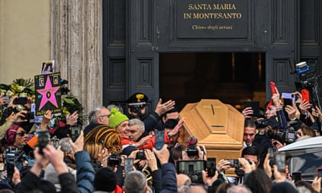 The coffin of Gina Lollobrigida is carried out of the Chiesa degli artisti into Piazza del Popolo in Rome. 