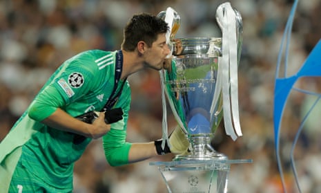 Real Madrid goalkeeper Thibaut Courtois deservedly kisses the trophy.