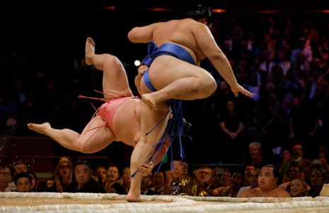 Onosato throws Ura out of the ring