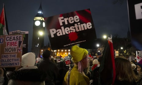Pro-Palestinian protesters in London at night with Big Ben in background