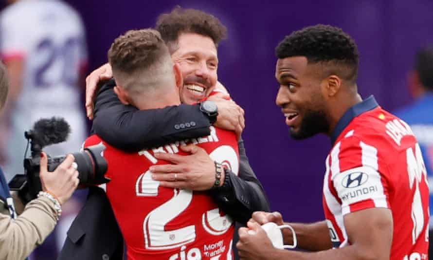 Kieran Trippier is embraced by Atlético Madrid’s manager, Diego Simeone, after the title win.