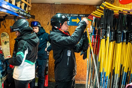Skiers returning poles