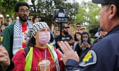 Public safety officer informs students they must disperse at the University of Southern California