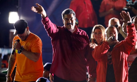 Venezuela’s president Maduro stands with supporters after the results of the election were released in Caracas