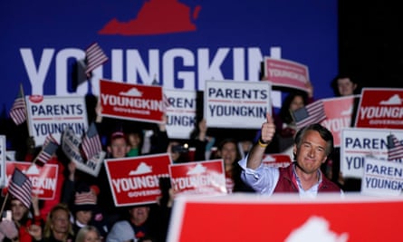 Glenn Youngkin gestures as people hold up ‘Parents for Youngkin’ signs at a campaign event in Leesburg, Virginia, in November 2021.
