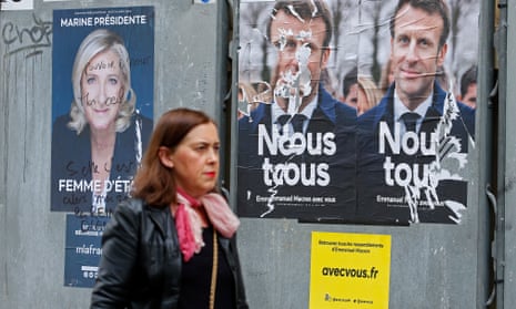 Woman walks past campaign posters