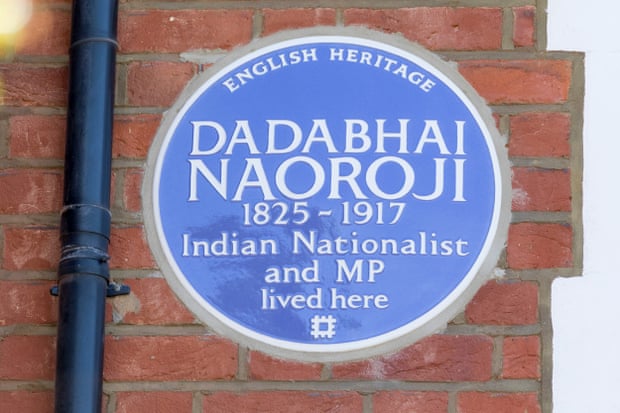 Plaque set on redbrick wall.