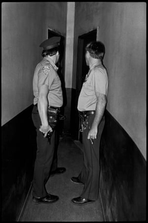 Two policeman at a door
