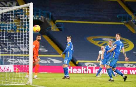 Brighton &amp; Hove Albion players watch the shot by Jack Harrison of Leeds United glance wide.