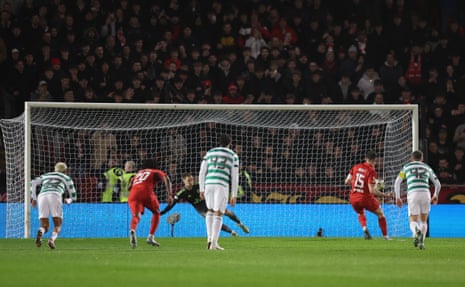 Aberdeen’s Kevin Nisbet sends Celtic keeper Viljami Sinisalo the wrong way to level the scores.