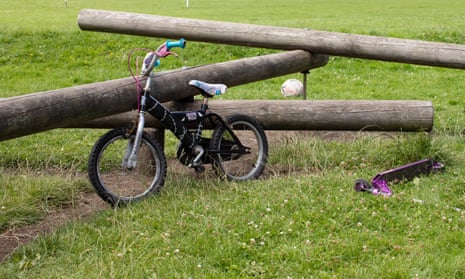 A children’s bike and scooter in the Jubilee Recreation Ground in Cardiff, South Wales, UK