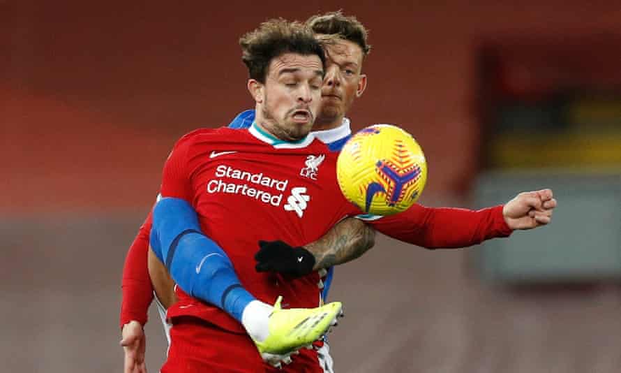 Liverpool’s Xherdan Shaqiri and Brighton’s Ben White compete for the ball.