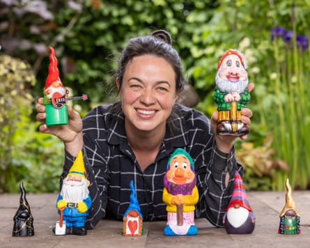 Frances Tophill and a selection of gnomes painted by celebrities