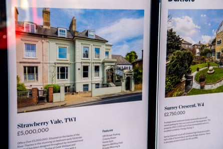 An estate agents window in Richmond borough shows a £5m house in Twickenham, which will merit a surcharge of £7,500.