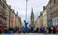 A street entertainer juggles on Edinburgh's Royal Mile during the final full week of the city's festival fringe on 22 August 2023.