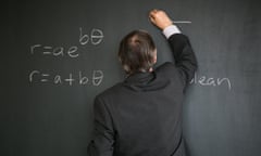 Teacher writing on blackboard