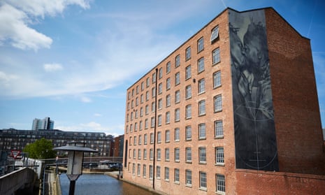 A mural in Manchester shows two men kissing